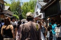 People walk from the station to Arashiyama bamboo grove in Kyoto, Japan. Man photographer with Nikon camera