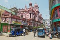 People walk by the street with colonial architecture building at the background in downtown Colombo, Sri Lanka. Royalty Free Stock Photo