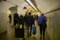 People walk in subway tunnel. People are walking on pedestrian crossing