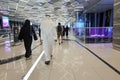 People walk to entrance to Dubai metro station at EXPO 2020. Modern design of underground station Royalty Free Stock Photo