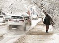 People walk on unclean sidewalk covered with danger ice after snowfall in Sofia, Bulgaria on Jan 21, 2022