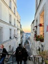 People walk up and down a Montmartre stairway on an October evening, Paris, France. Royalty Free Stock Photo