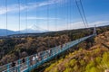 People walking on Mishima Skywalk bridge with Mount fuji seen in the distant, clear day Royalty Free Stock Photo