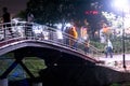 People walking across a bridge in Jaipur