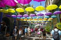 People walking across the main alley of Caudan Waterfront in Mauritius. The city is the country`s economic, cultural, political ce