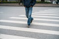 People walking across a street in Hanoi, Vietnam. Closeup Royalty Free Stock Photo