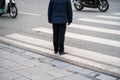 People walking across a street in Hanoi, Vietnam. Closeup Royalty Free Stock Photo