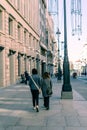 People walking by Alcala Street and Galeria Canalejas in Madrid