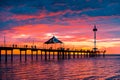 People walking along Brighton jetty at sunset Royalty Free Stock Photo