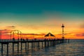 People walking along Brighton jetty at sunset Royalty Free Stock Photo