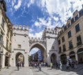 People walking along through the Karlstor gate in Munich