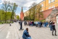 People walking along of the Kremlin walls in Alexander garden. Royalty Free Stock Photo