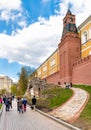 People walking along of the Kremlin walls in Alexander garden. Royalty Free Stock Photo