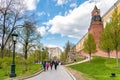 People walking along of the Kremlin walls in Alexander garden. Royalty Free Stock Photo