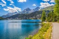 People walking along Lake Sankt Moritz in Swiss Alps Royalty Free Stock Photo