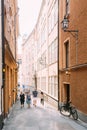 People Walking Along One Of Narrow Streets In Stockholm, Sweden Royalty Free Stock Photo