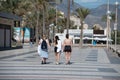 People walking along the Paseo Maritimo de San Juan in Alicante in 2022 Royalty Free Stock Photo