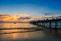 People walking along pier at Glenelg