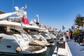 People walking along pier with luxurious motoryachts Puerto BanÃÂºs Spain Royalty Free Stock Photo