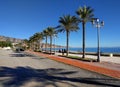 People walking along the seafront promenade of Aguadulce. Spain