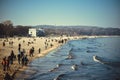 People walking along the seashore with waves