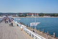 People walking along the Sopot Pier Molo, the longest wooden pier in Europe, Poland.