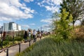 People Walking along a Trail at Little Island in New York City with a Skyline View during the Summer Royalty Free Stock Photo