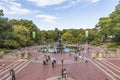 People walking around the Bethesda Fountain in Autumn Central Park