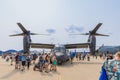 People walking around a Boeing CV-22 Osprey at EAA AirVenture 2021.