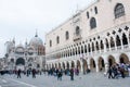 People walking around the Doge`s Palace and San Marco Basilica, Venice, Italy Royalty Free Stock Photo