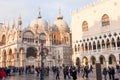 People walking around the Doge`s Palace and San Marco Basilica, Venice, Italy Royalty Free Stock Photo