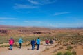People walking around the trail of the beautiful Horseshoe Bend