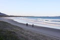 People walking on the beach at Crowdy National Park, NSW, Australia