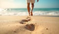 People walking on the beach with footprints in sand Royalty Free Stock Photo