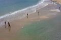 People walking on the beach of La Concha in the city of Donostia