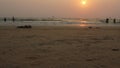 People Walking By On the Beach During Sunset In Goa , Bhaga beach