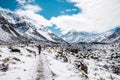 People walking on the boardwalk in Hooker Valley track. Winter snow after a snowy day scene. Mount Cook National Park