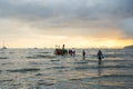 People walking from boat at Ao Nang beach before the sunset Royalty Free Stock Photo