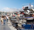 People walking by the Bosphorus between Bebek and Hisari districts, beside docked boats and yachts, Istanbul, Turkey Royalty Free Stock Photo