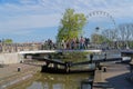 People are walking on the bridge over the canal Royalty Free Stock Photo