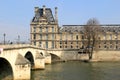 People walking on bridge over The Seine, leading to The Louvre, Paris,France,2016