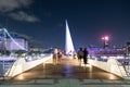 People Walking Through the pedestrian bridge Puente de la Mujer