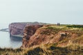 People walking on the cliffs of an island