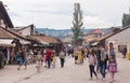 People walking close to Sebilj fountain in Pigeon Square, Bascarsija, Sarajevo, Bosnia and Herzegovina.