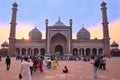 People walking in a courtyard of Jama Masjid at sunset, Delhi, I