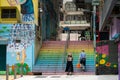 People walking down the colorful stairs in Hong Kong