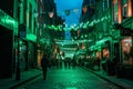 people walking down a dark city alley during the day at night Royalty Free Stock Photo