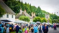 People walking down the street during a medieval fair in Milton Abbas, UK Royalty Free Stock Photo