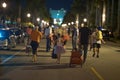 People walking down the streets trick or treating on Halloween night