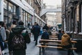 People walking on Dray Walk towards Elys Yard off Brick Lane, East London, UK